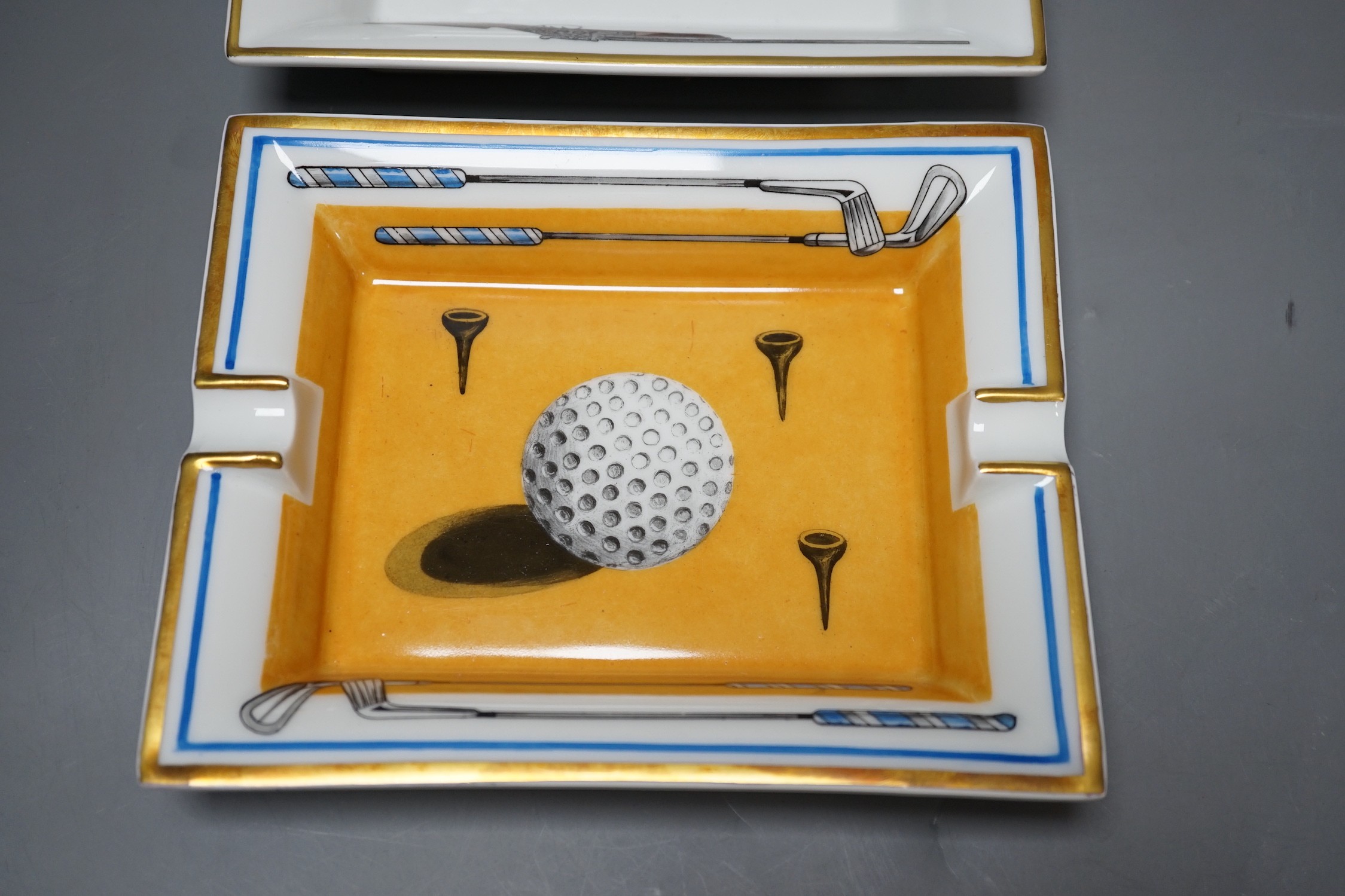 Two Hermes, Paris porcelain ashtrays: one golfing related (boxed), the other hunting related, golf ashtray 19 cms x 15 cms